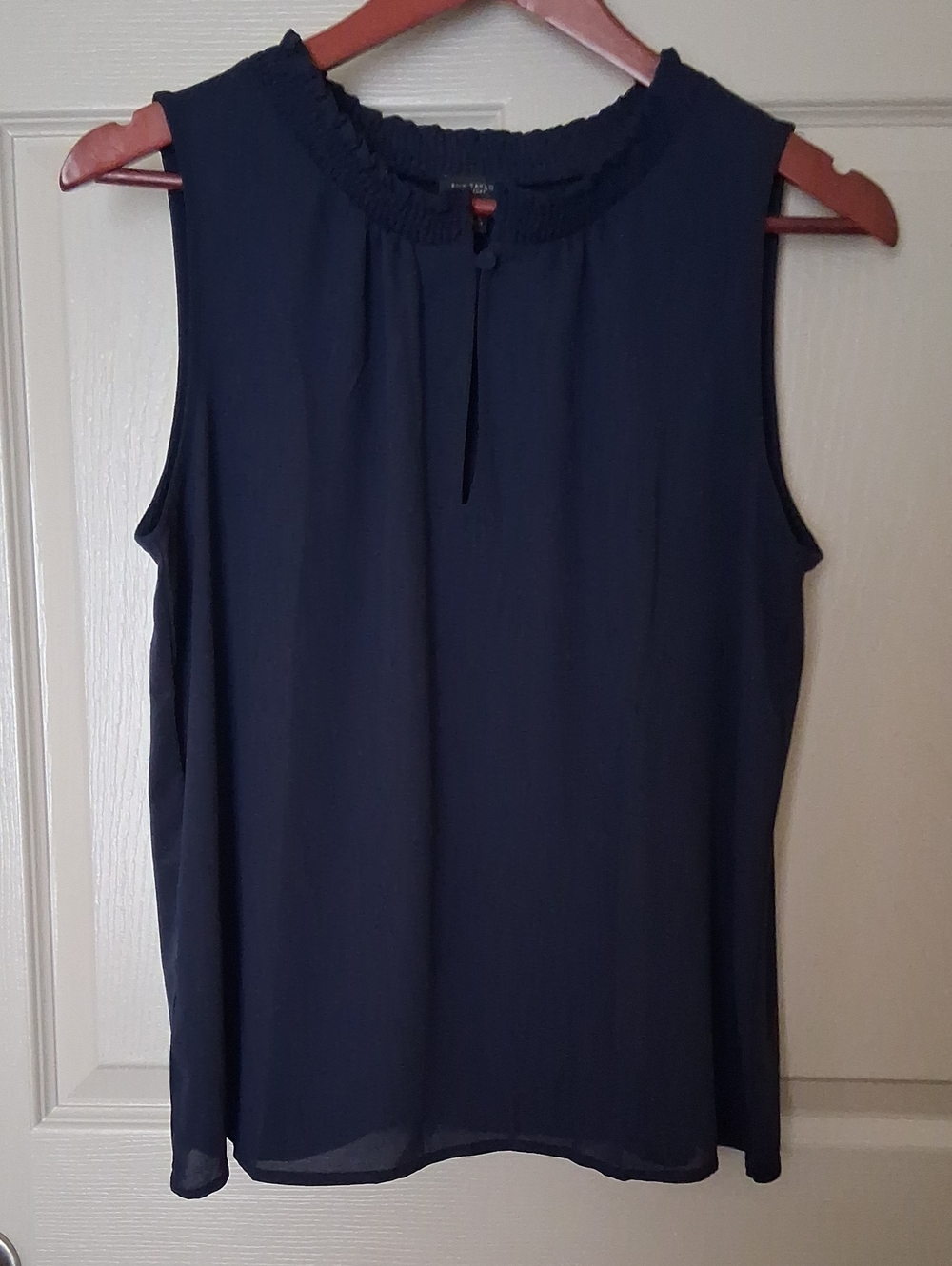 Sleeveless Ruffle Collar Blouse